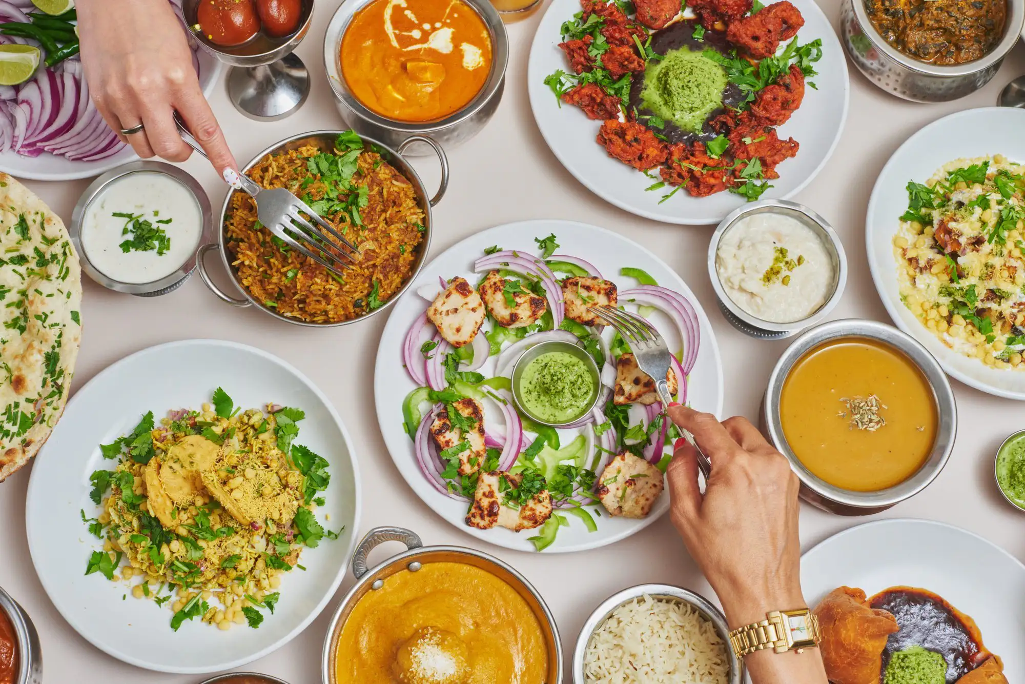 Indian dishes and drinks plated for service